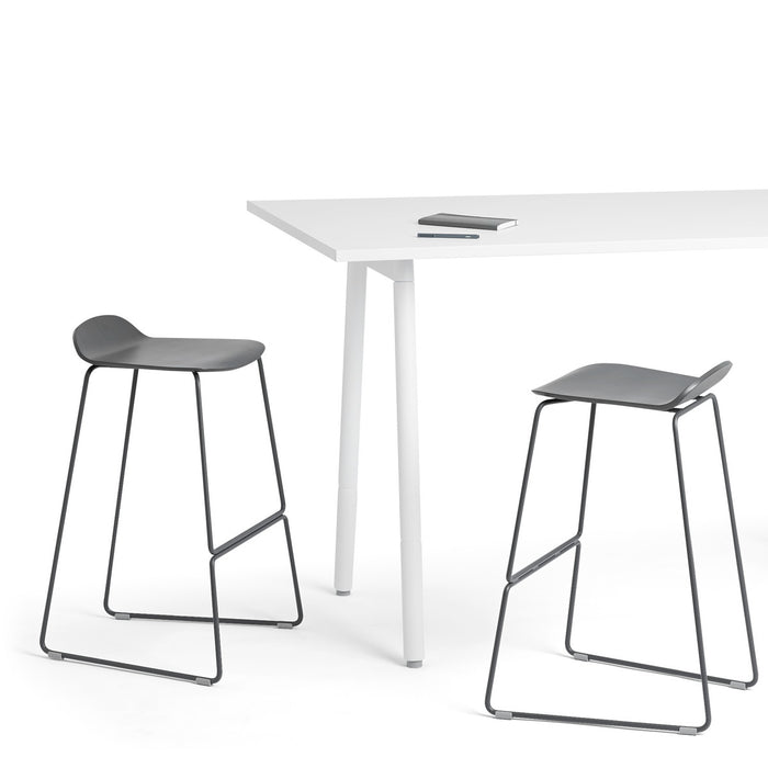 Modern white desk with black bar stools on a white background. (Charcoal)