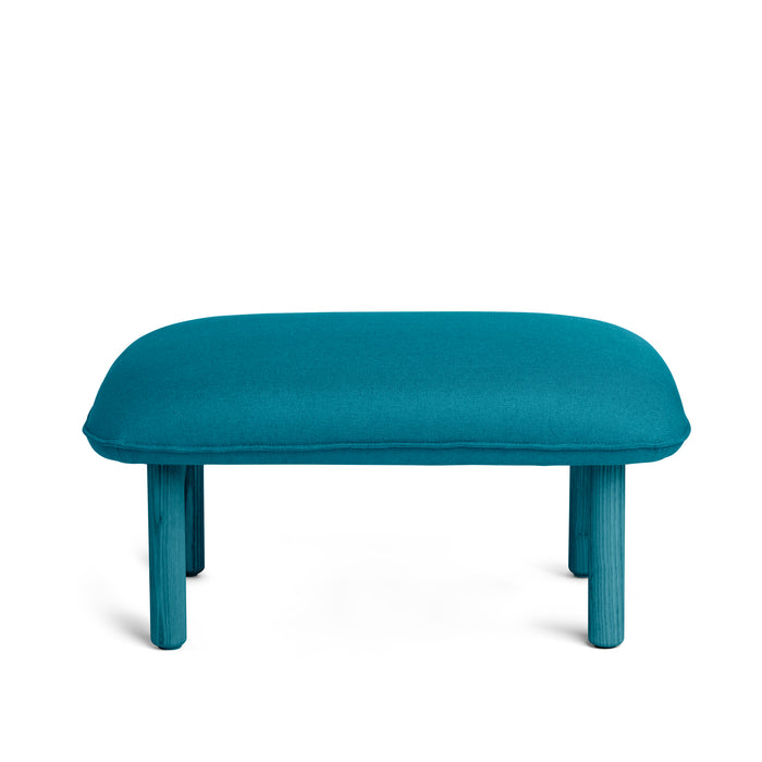 Turquoise upholstered footrest ottoman on a white background. (Teal)