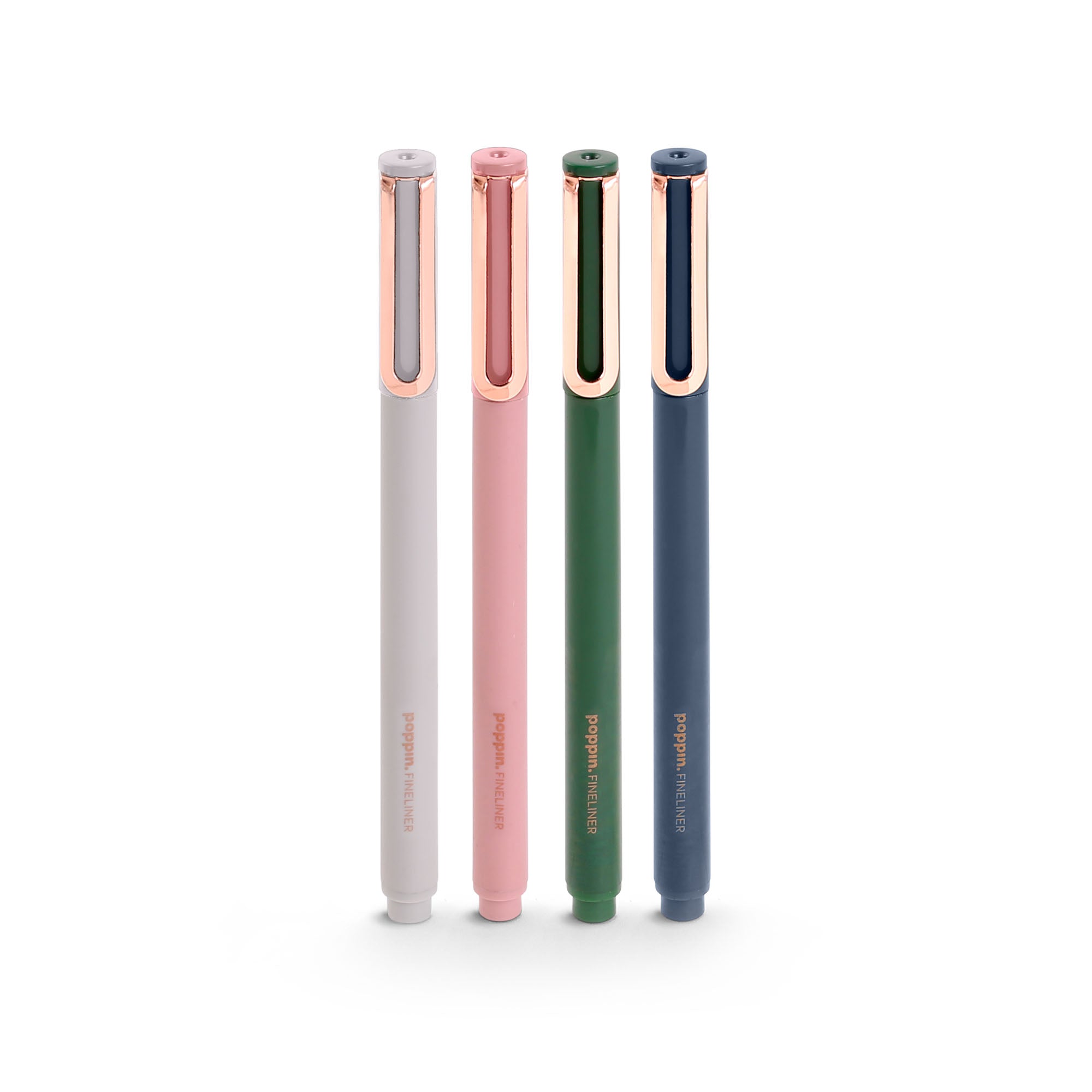 Four stylish pens in navy, green, pink, and white colors standing upright on (Velvet)