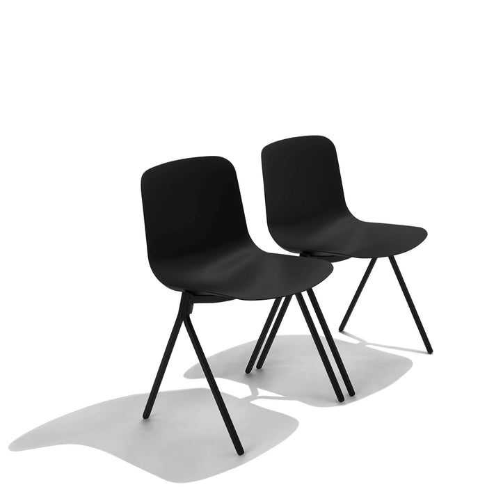 Two black modern chairs on white background with shadows. (Black)