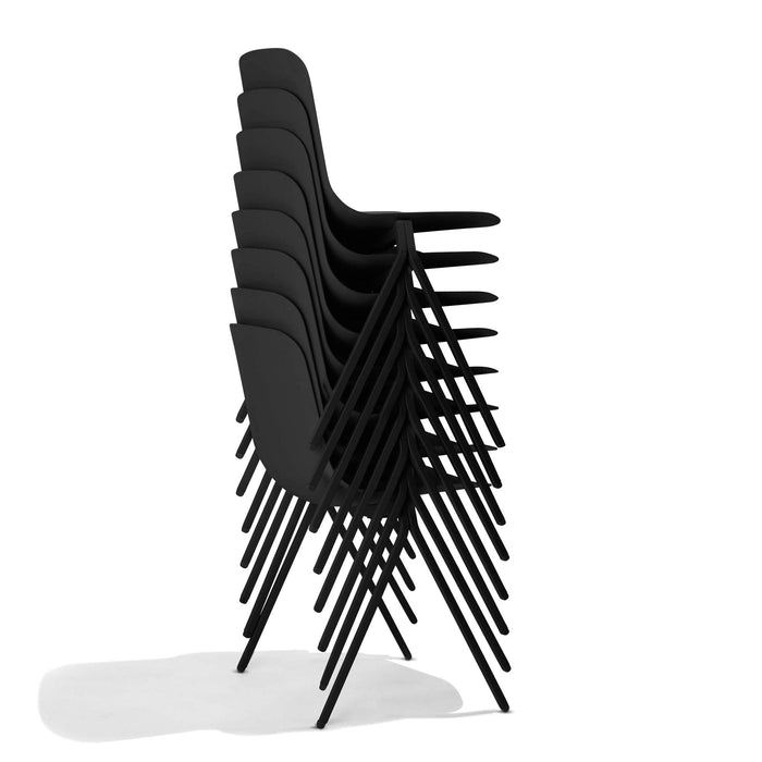 Stack of black modern design chairs on white background. (Black)