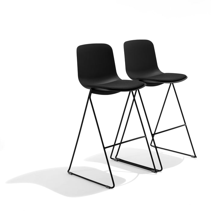 Two modern black bar stools with metal legs isolated on white background. (Black)