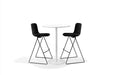Modern black bar stools beside a white round table on a white background. (Black)