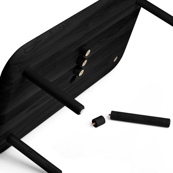 Black wooden table with disassembled legs on a white background. (Black)