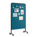 Mobile blue bulletin board on wheels with notes and pictures pinned. (Black-Teal)