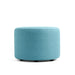 Blue fabric ottoman on a white background. (Blue)