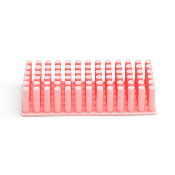 Pink plastic hair comb on a white background. (Blush)