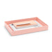 Pink desk tray with white papers and a beige notebook on a white background. (Blush)