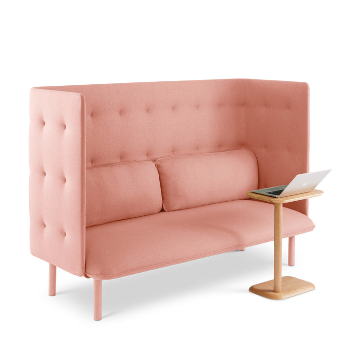 Pink two-seater tufted sofa with laptop on side table against white background. (Blush-Blush)(Blush-Gray)