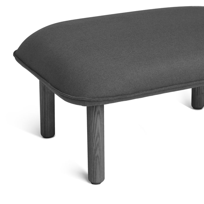 Modern charcoal gray upholstered bench with dark wooden legs on white background. (Dark Gray)