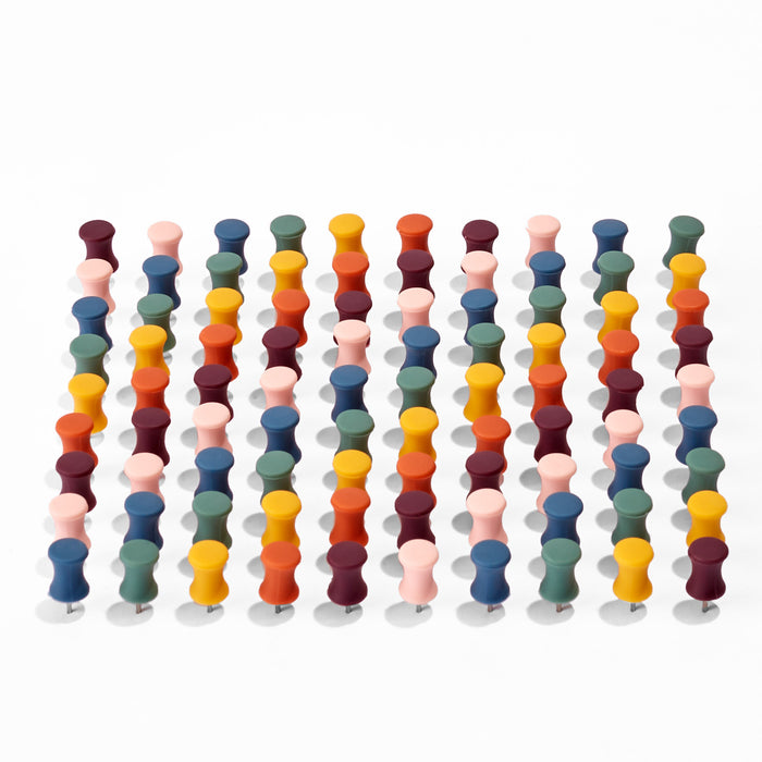 Colorful game pawns in rows on white background (Assorted)
