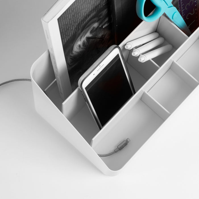"Open white desk organizer with smartphone, pens, notebook, and earphones on a grey background" (Dark Gray)(Slate Blue)(White)