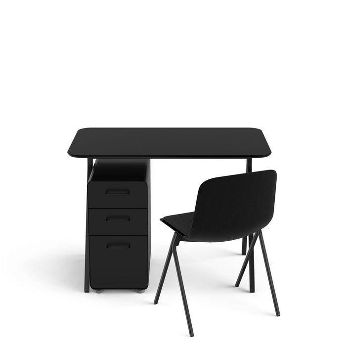 Black office desk with drawers and a black chair on white background. (Black)