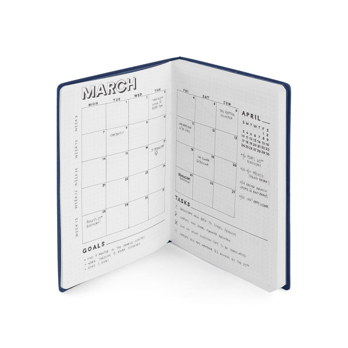 Open planner with monthly calendar showing March and April pages. (Lagoon)