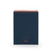 Navy blue spiral-bound notebook with 'work happy' slogan on cover against white background. (Lagoon)