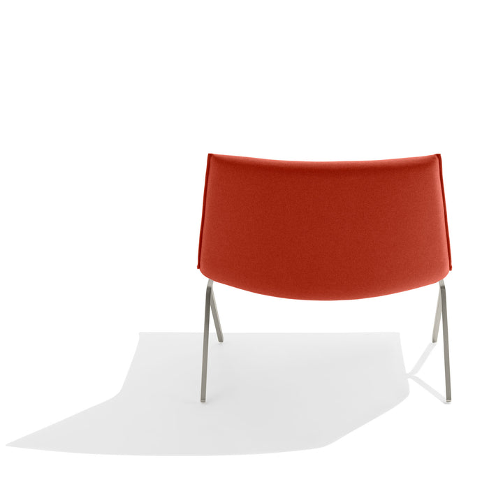 Modern red fabric lounge chair with stainless steel legs on white background. (Brick-Nickel)