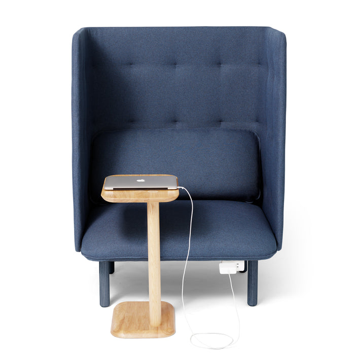 Modern blue armchair with a wooden side table and a charging smartphone. (Natural Ash)