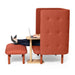Woman using laptop with feet up on orange modern chair and ottoman (Natural Ash)