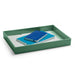 Green desk organizer tray with blue notebook and white tablet on a white background. (Sage)