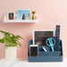 Desk organizer with stationery, smartphone, plant, and wall shelf with pictures and decor. (Slate Blue)