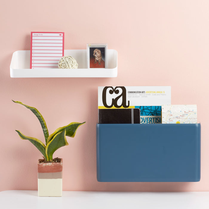 Modern home office shelf with decorative items and storage organizer against a pink wall. (Slate Blue)
