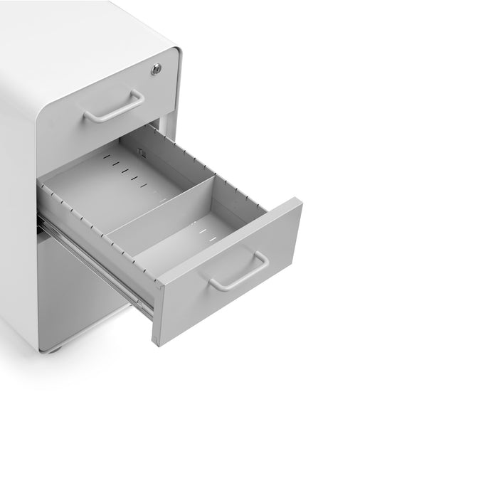 Open drawer of a modern white filing cabinet on a white background. (Light Gray)
