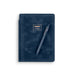 Navy blue notebook with a matching pen from poppin brand on white background. (Storm)