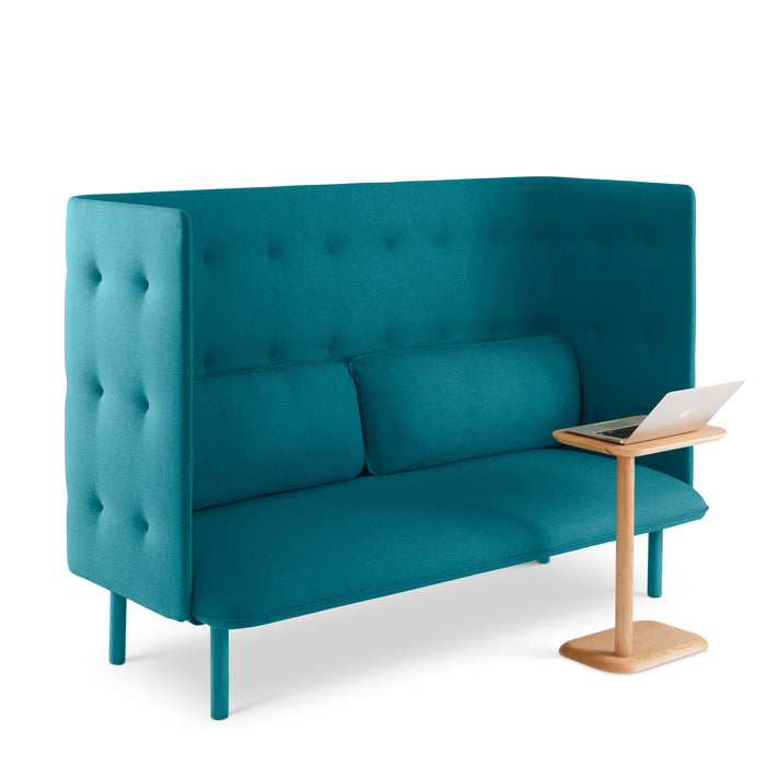 Teal blue tufted two-seater sofa with a modern laptop on a small wooden side table against a white background. (Teal-Teal)(Teal-Dark Gray)