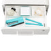 Top-down view of an organized desk drawer with office supplies including a stapler, pens, and notepads. (White)