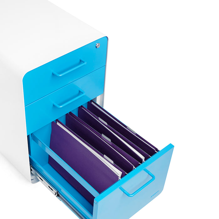 White office filing cabinet with open blue drawer full of purple folders. (Pool Blue-White)