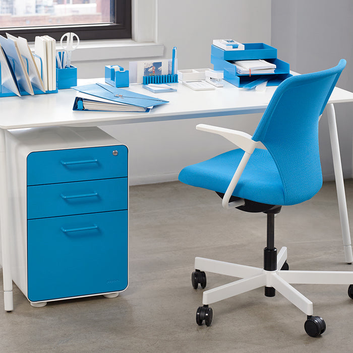 Blue office chair and matching stationary at a modern white desk setup (Pool Blue-White)
