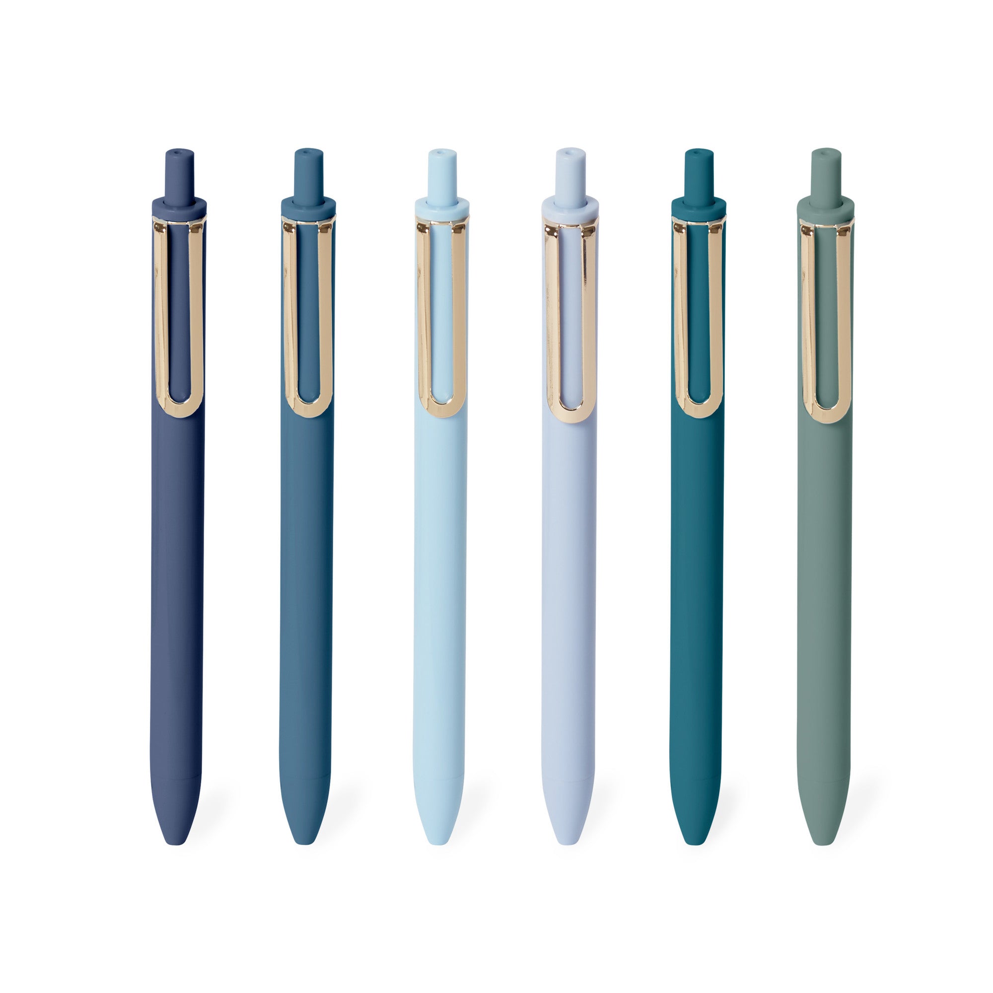 Variety of color ballpoint pens with caps on white background. 