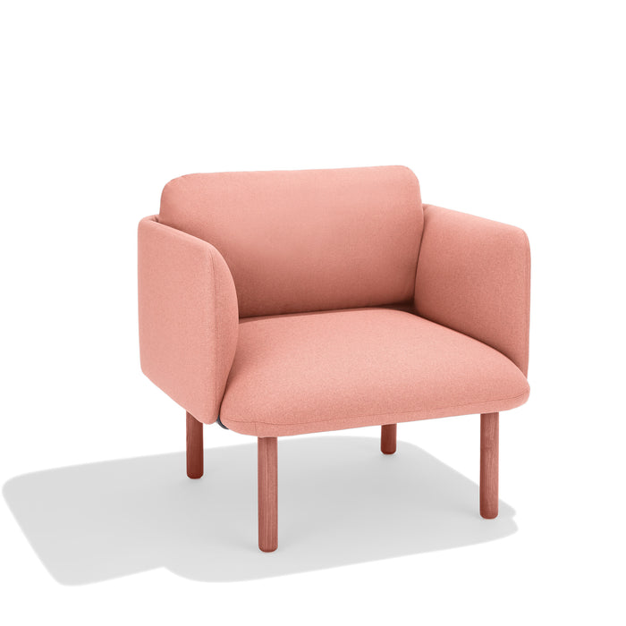 Modern coral pink armchair with wooden legs on a white background. (Blush)