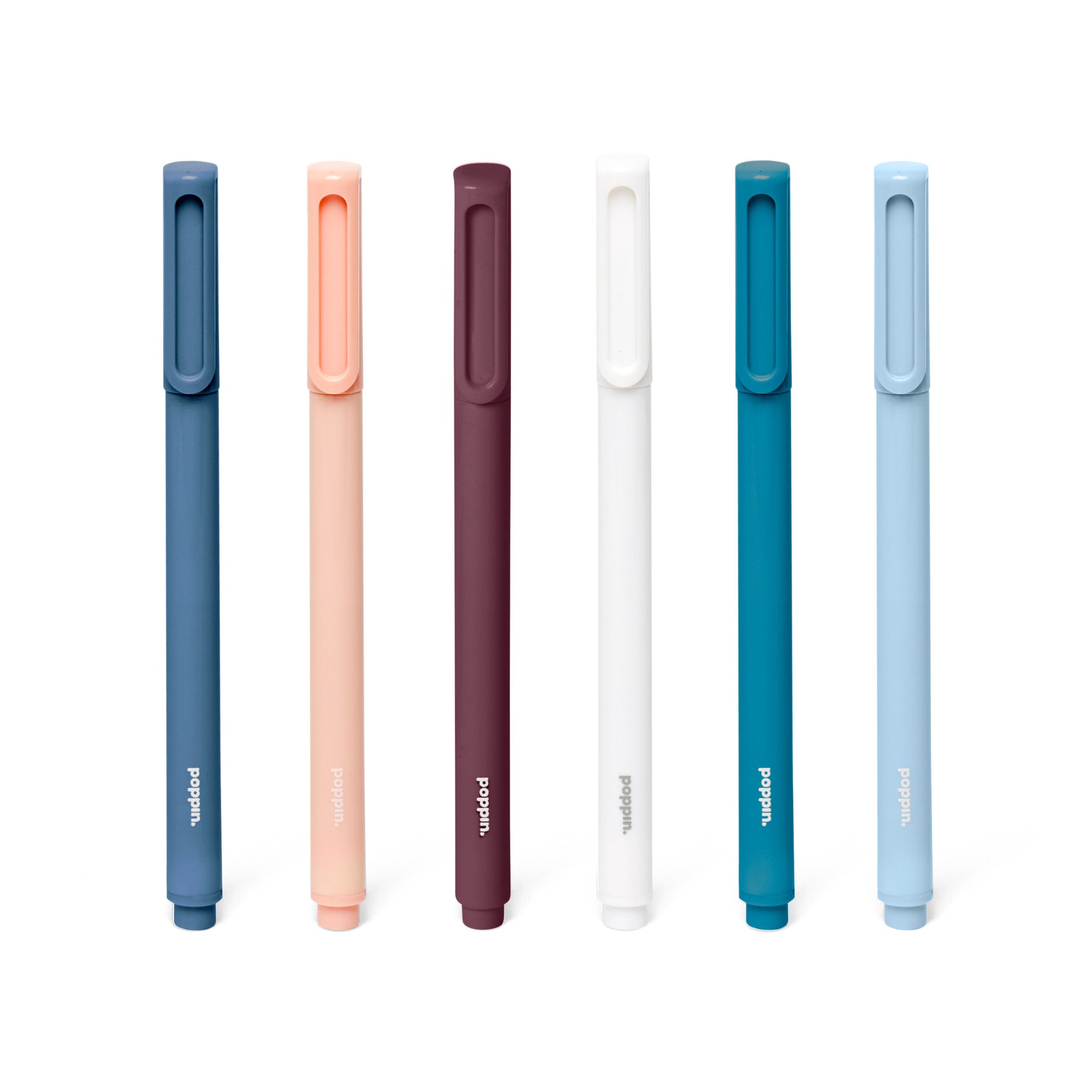 Assortment of sleek modern pens in navy, coral, burgundy, white, and sky blue on white background. 