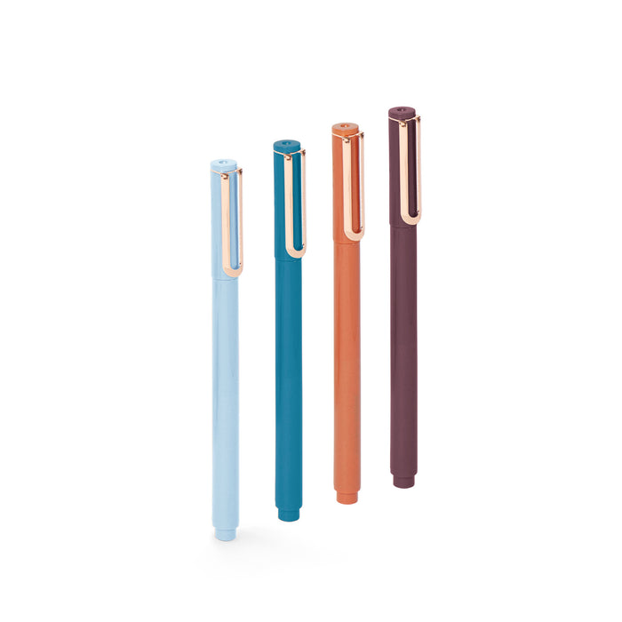 Set of four stylish pens in blue, teal, orange, and brown standing upright (Elements)