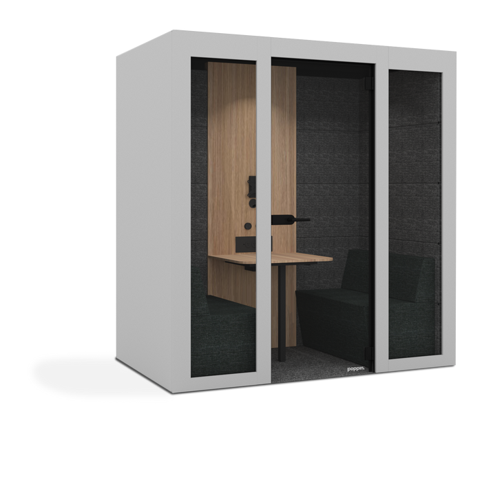 Modern office pod with a wooden desk and black seating area (White)