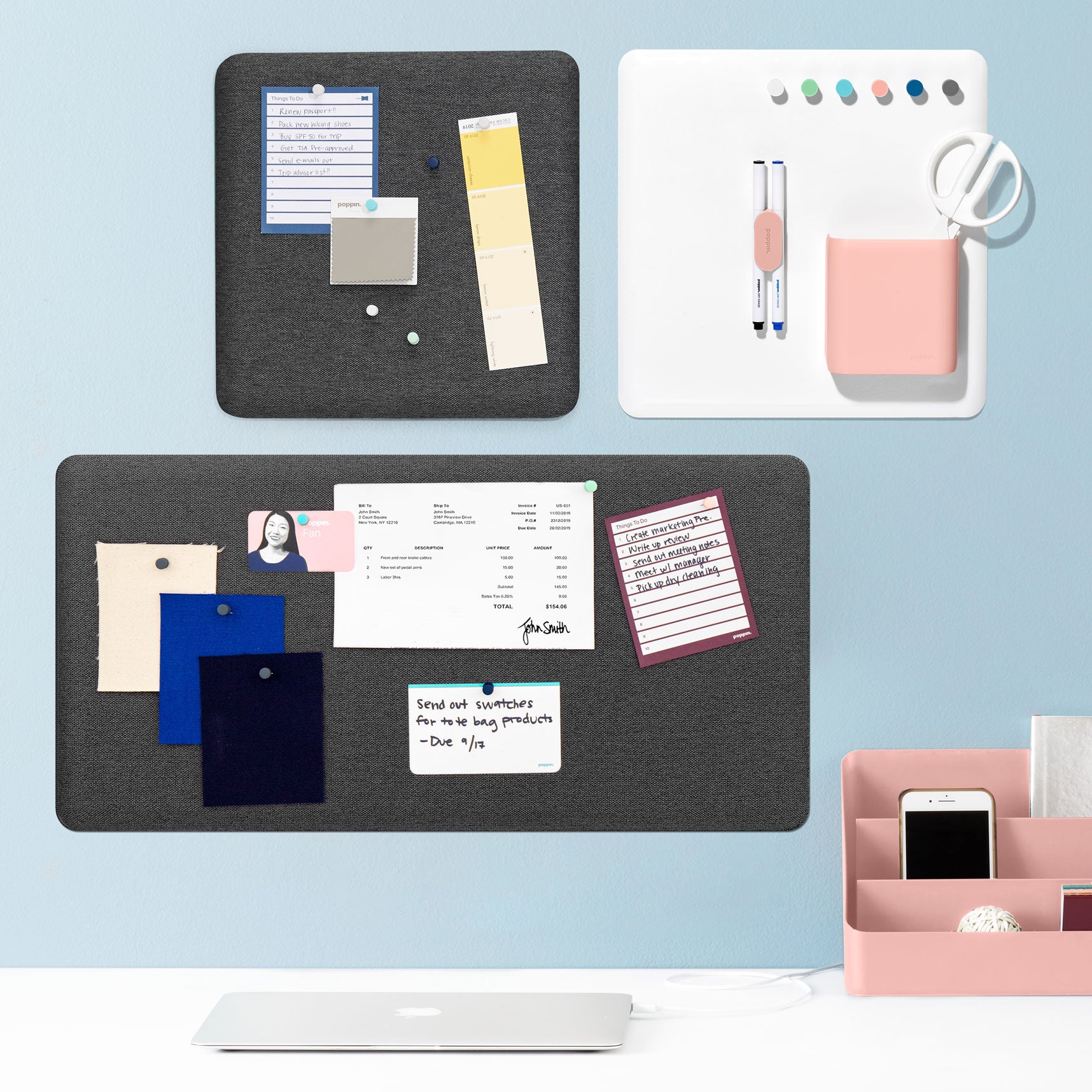 Modern home office wall with organized bulletin boards and desk accessories. 