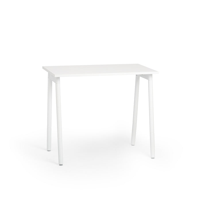 Minimalist white desk isolated on a white background. 