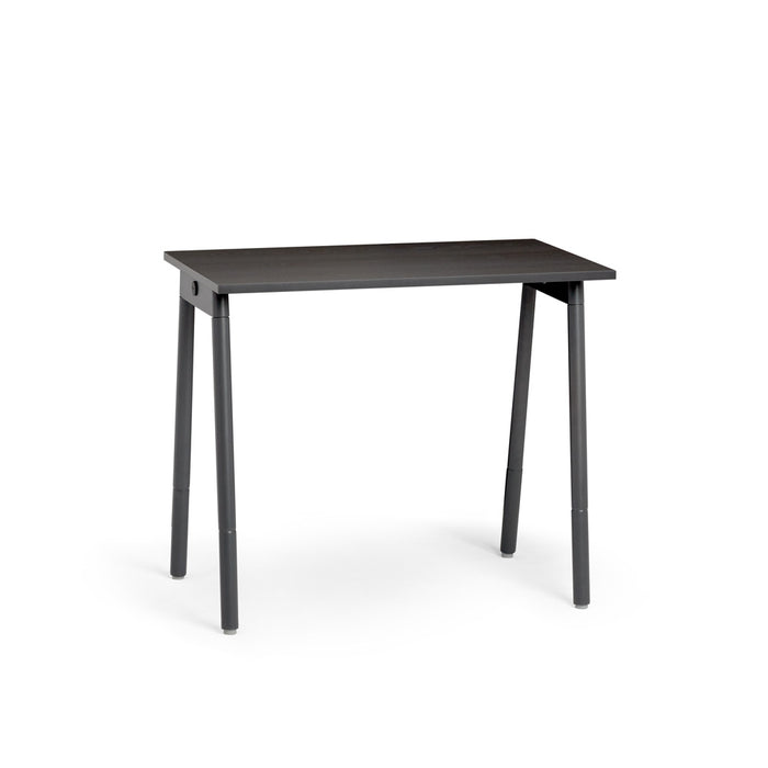 Modern black wooden desk isolated on white background 