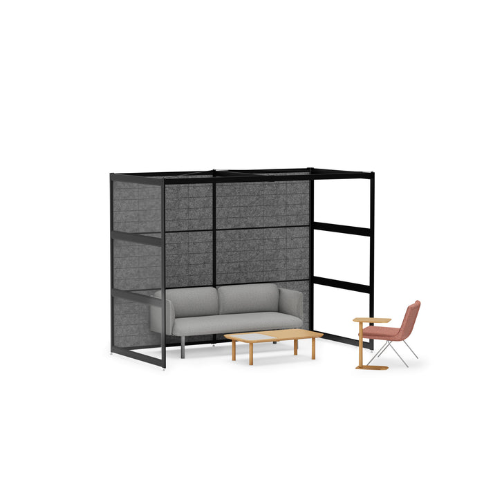 Modern office lounge area with gray sofa, privacy panels, and wooden coffee table. (Black-Semi-Private-Black Panel)