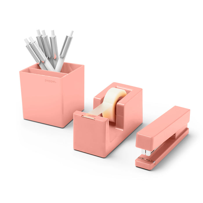 Pink desk organizer set including pens, tape dispenser, and stapler on white background. (Blush)