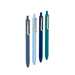 Four colorful pens standing vertically on a white background. 