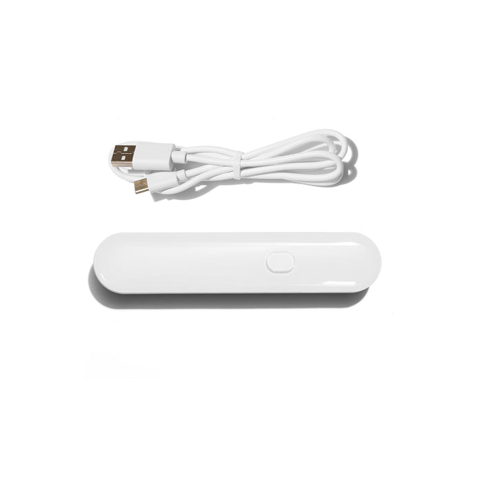 White USB cable and portable power bank on a white background. 