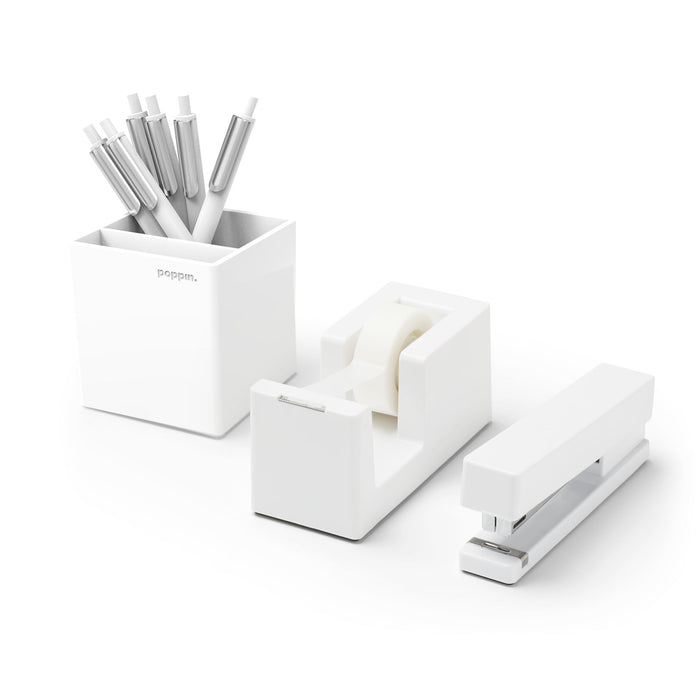 White office supplies including pens, tape dispenser, and stapler on a white background. (White)