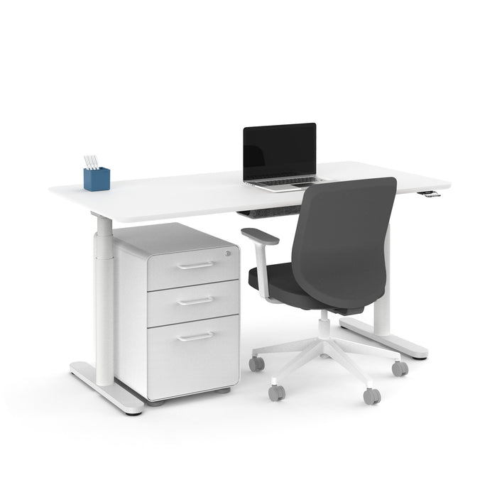 Modern office desk setup with laptop, ergonomic chair, and mobile pedestal on white background. (White-60&quot;)