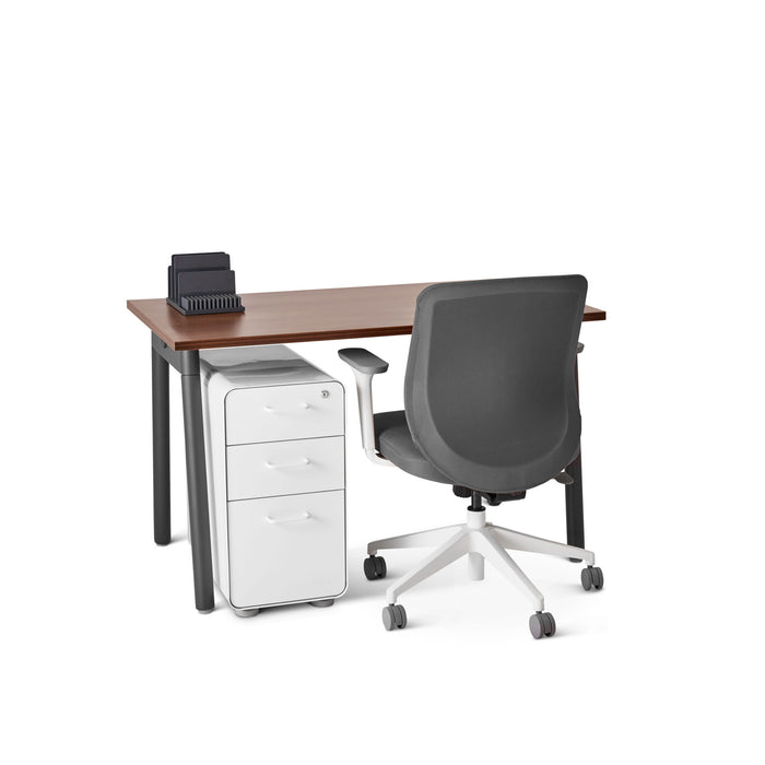 Modern office desk with wooden top, white file cabinet, and black ergonomic chair on white background. (Walnut-47&quot;)
