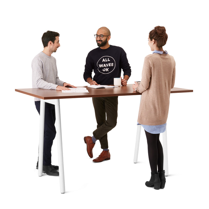 Three professionals having a standing meeting at a high table. (Walnut-72&quot; x 36&quot;)(Walnut-72&quot; x 36&quot;)