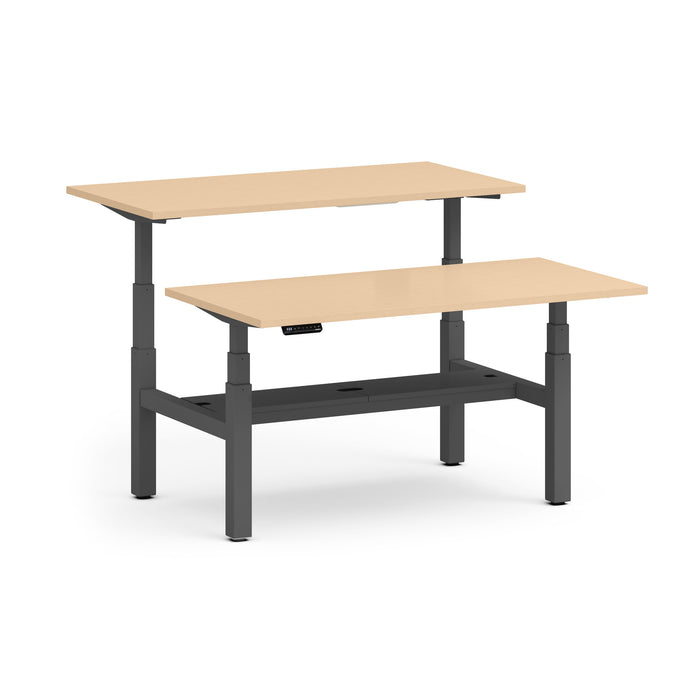 Adjustable height standing desk with dual-tiered wooden tabletops and a black frame. (Natural Oak-60&quot;)