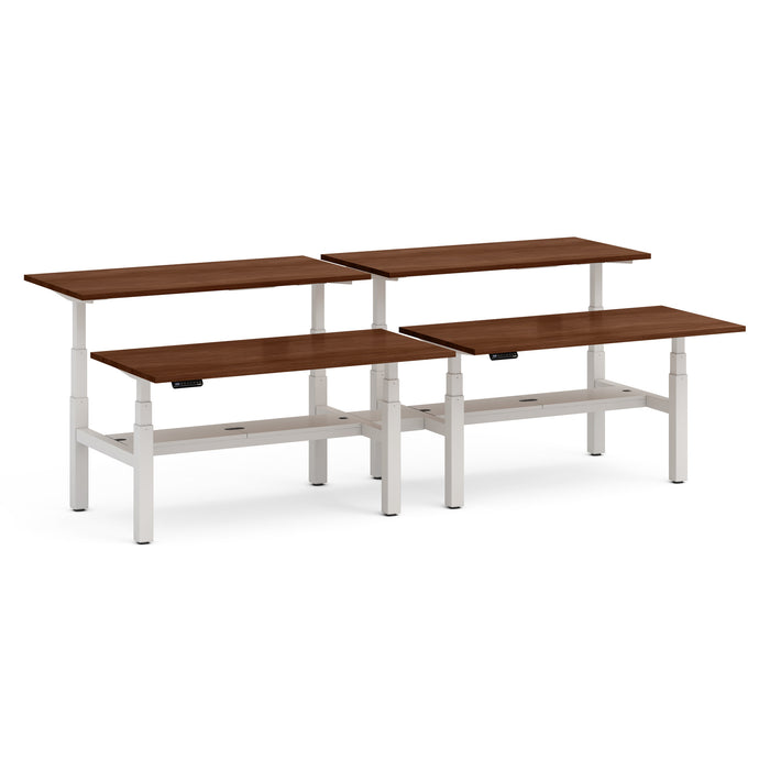 Adjustable height desks in different sizes with white frames and brown tops. (Walnut-60&quot;)