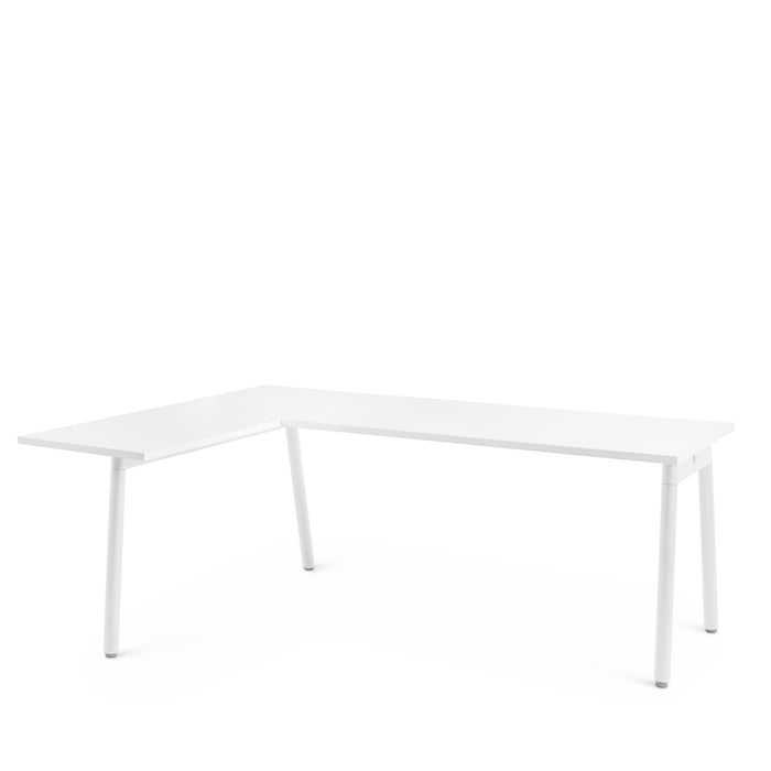 Modern white L-shaped office desk isolated on white background. (White)